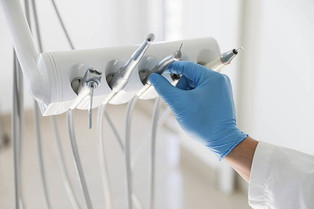 Professional Tooth Extraction technician working in Manhasset, NY